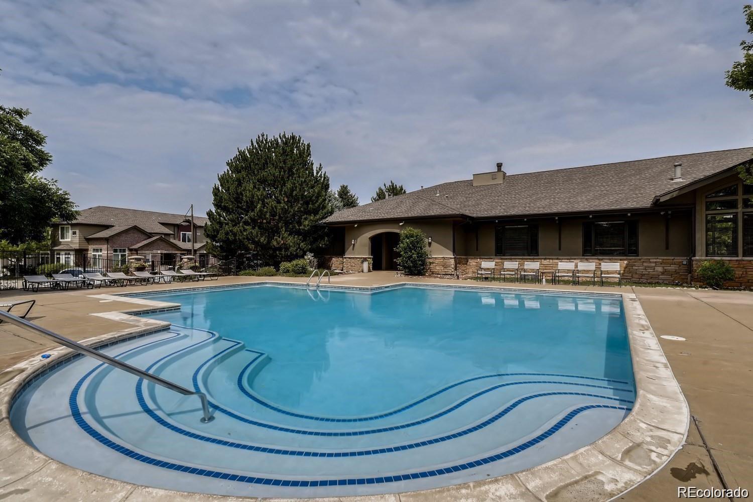 6478 Silver Mesa Drive, Unit E Highlands Ranch, CO 80130 - Photo 31 of 34 a view of swimming pool with outdoor seating