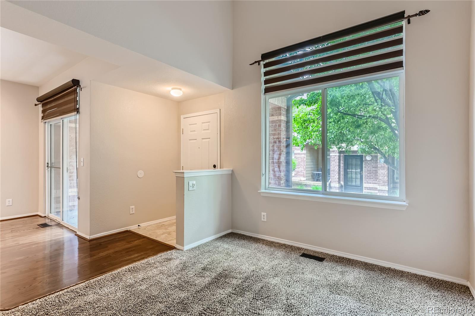 6478 Silver Mesa Drive, Unit E Highlands Ranch, CO 80130 - Photo 5 of 34 an empty room with windows