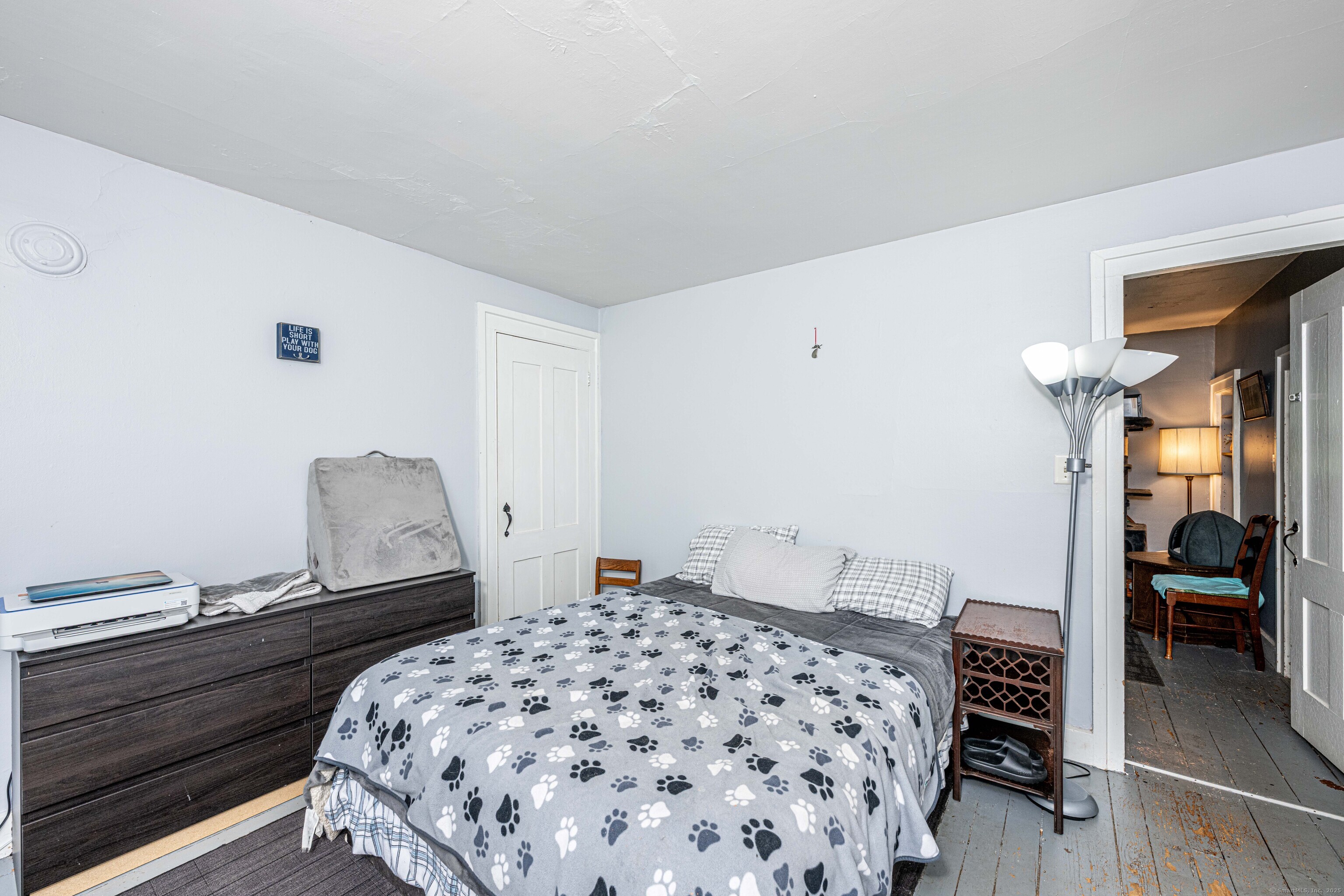 174 Whitfield Street Guilford, CT 06437 - Photo 19 of 40 a bedroom with a bed and a walk in closet