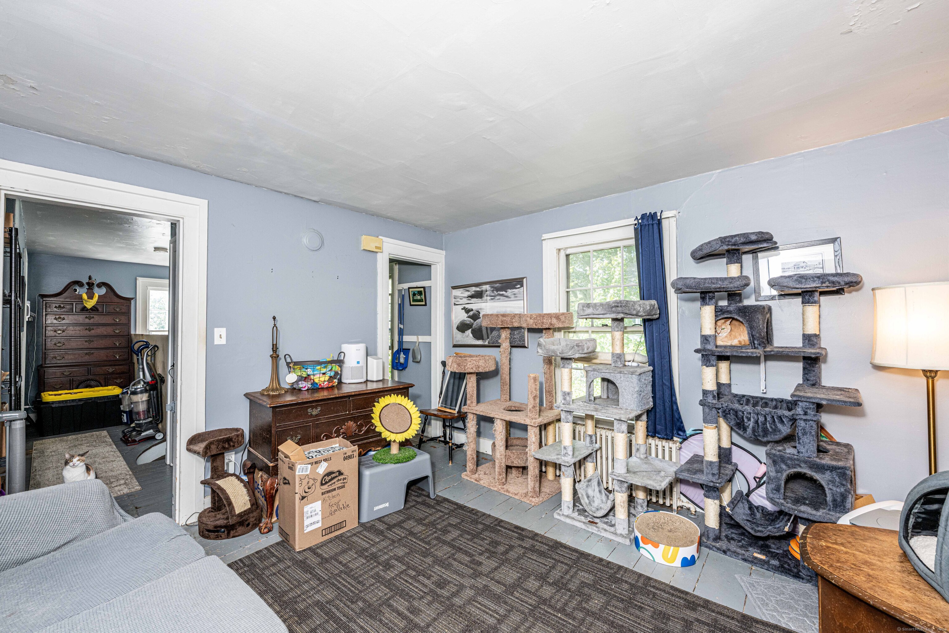 174 Whitfield Street Guilford, CT 06437 - Photo 21 of 40 a living room with furniture and a wooden floor