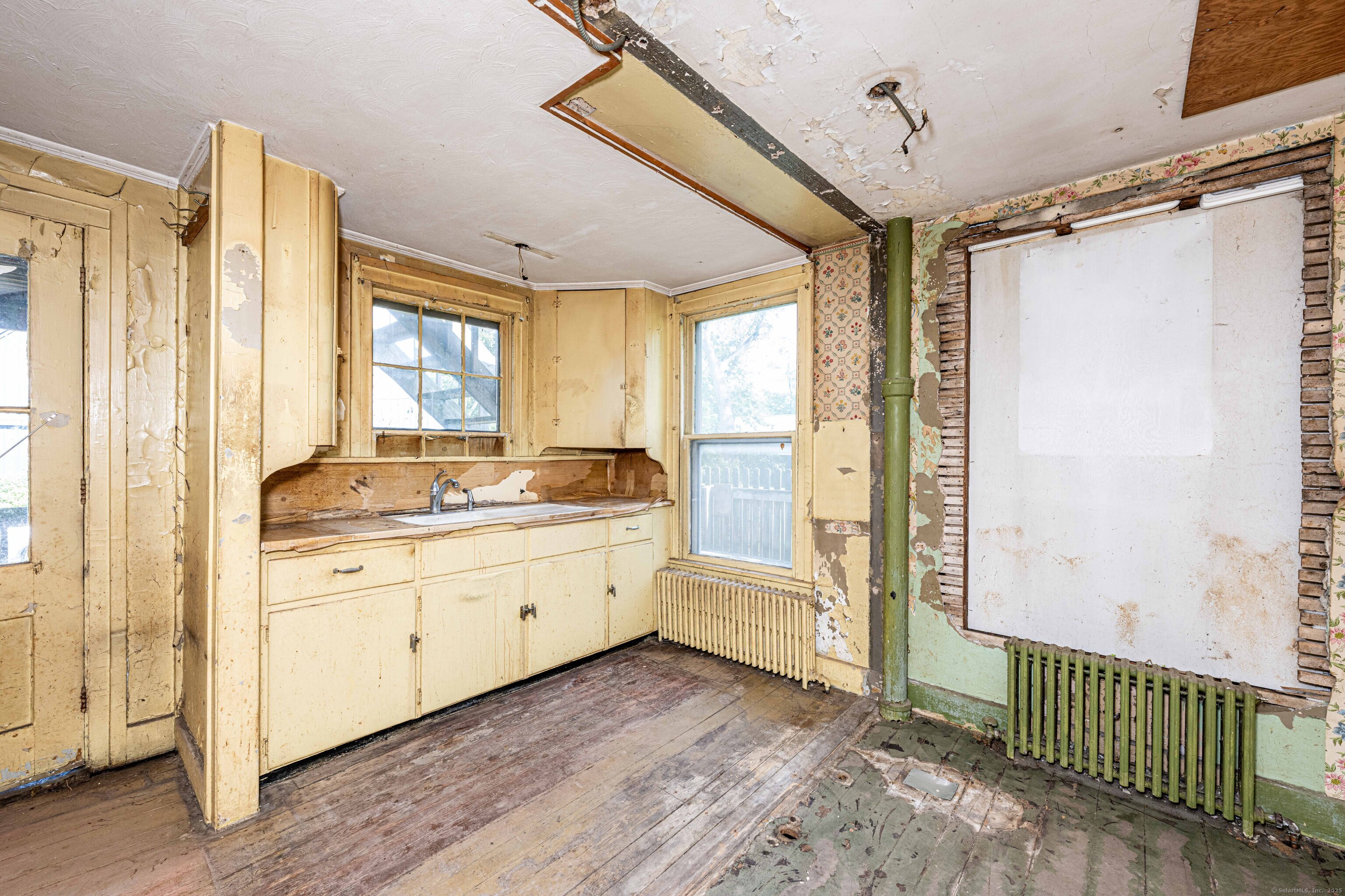 174 Whitfield Street Guilford, CT 06437 - Photo 27 of 40 a bathroom with a granite countertop sink mirror and a shower