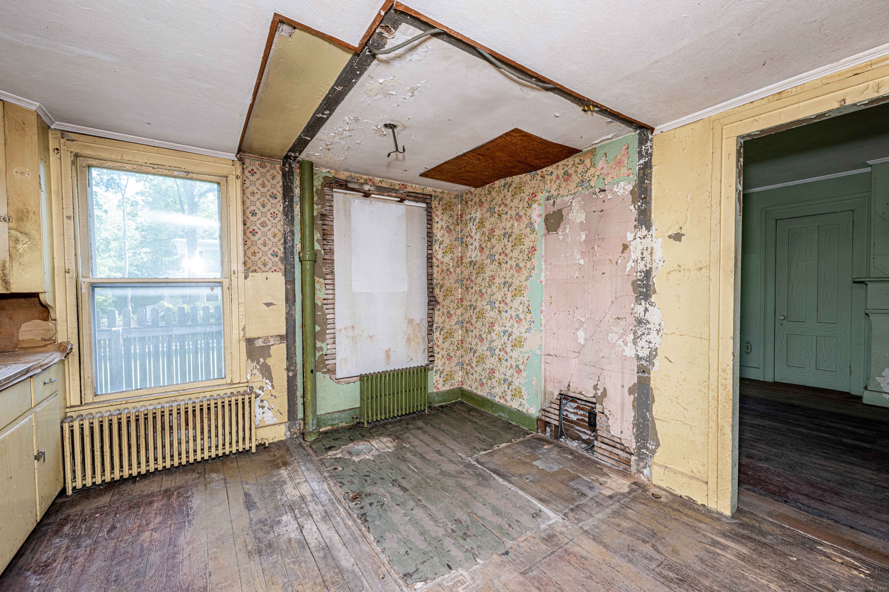174 Whitfield Street Guilford, CT 06437 - Photo 28 of 40 an empty room with wooden floor and windows
