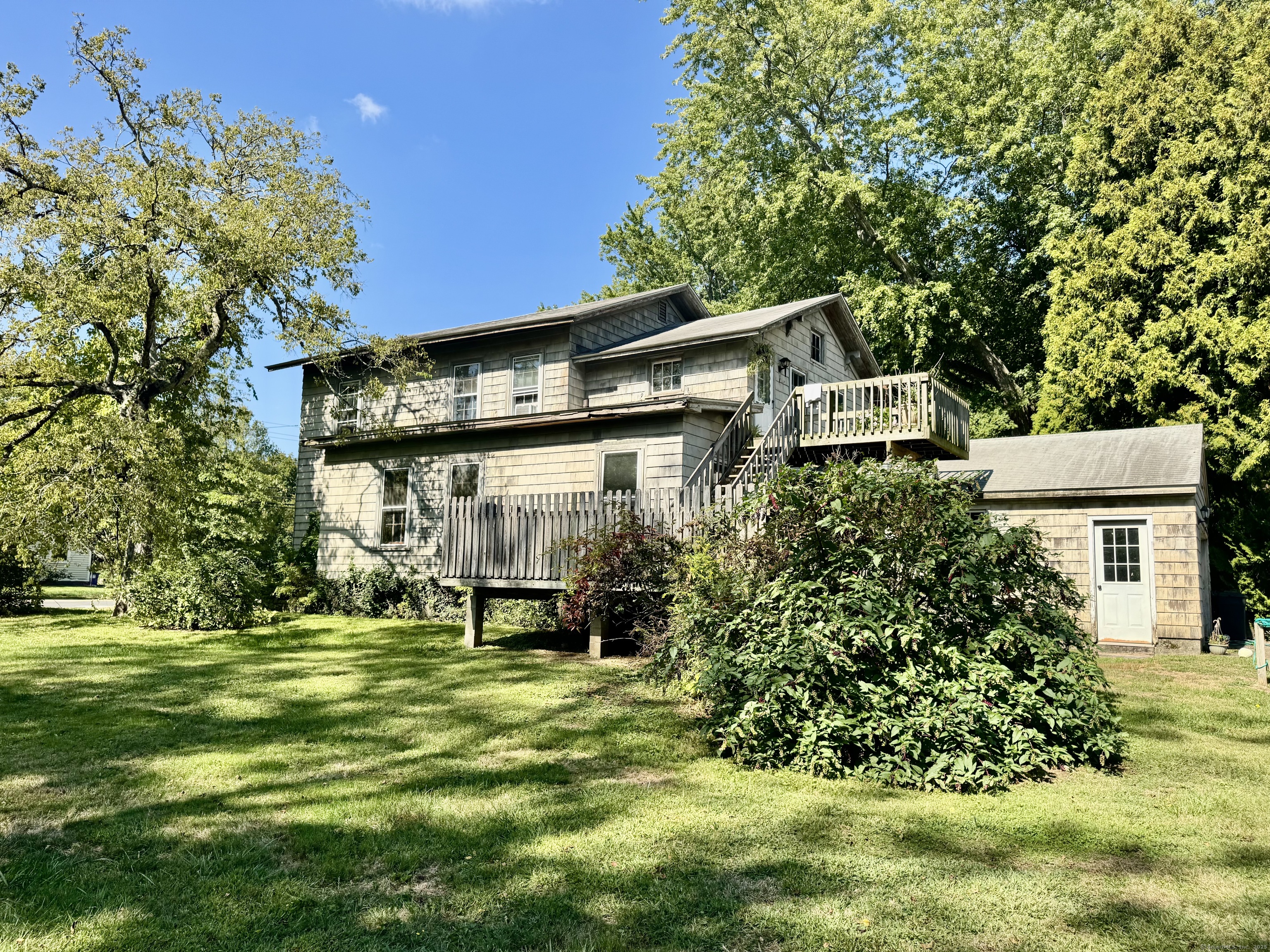 174 Whitfield Street Guilford, CT 06437 - Photo 3 of 40 a front view of a house with a yard