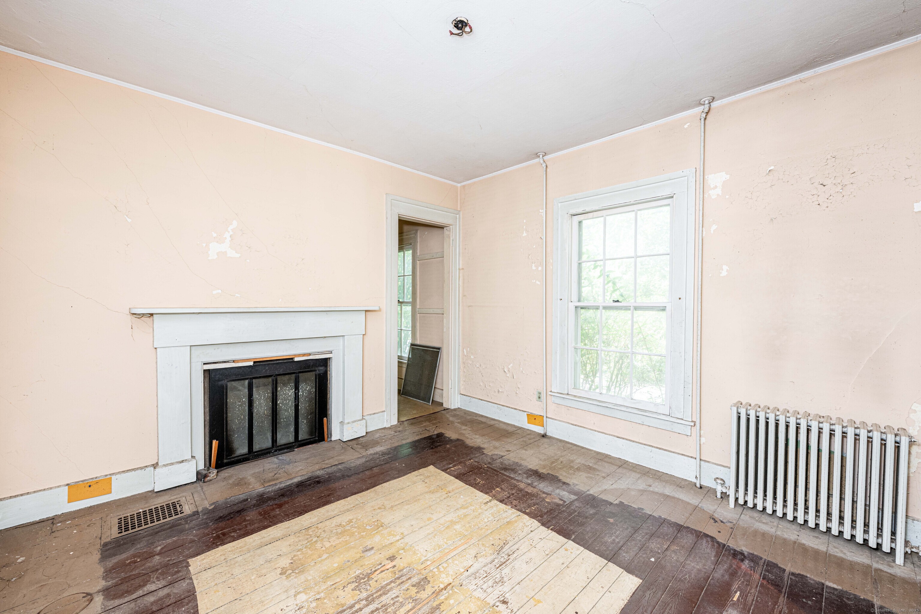 174 Whitfield Street Guilford, CT 06437 - Photo 35 of 40 an empty room with windows and fireplace