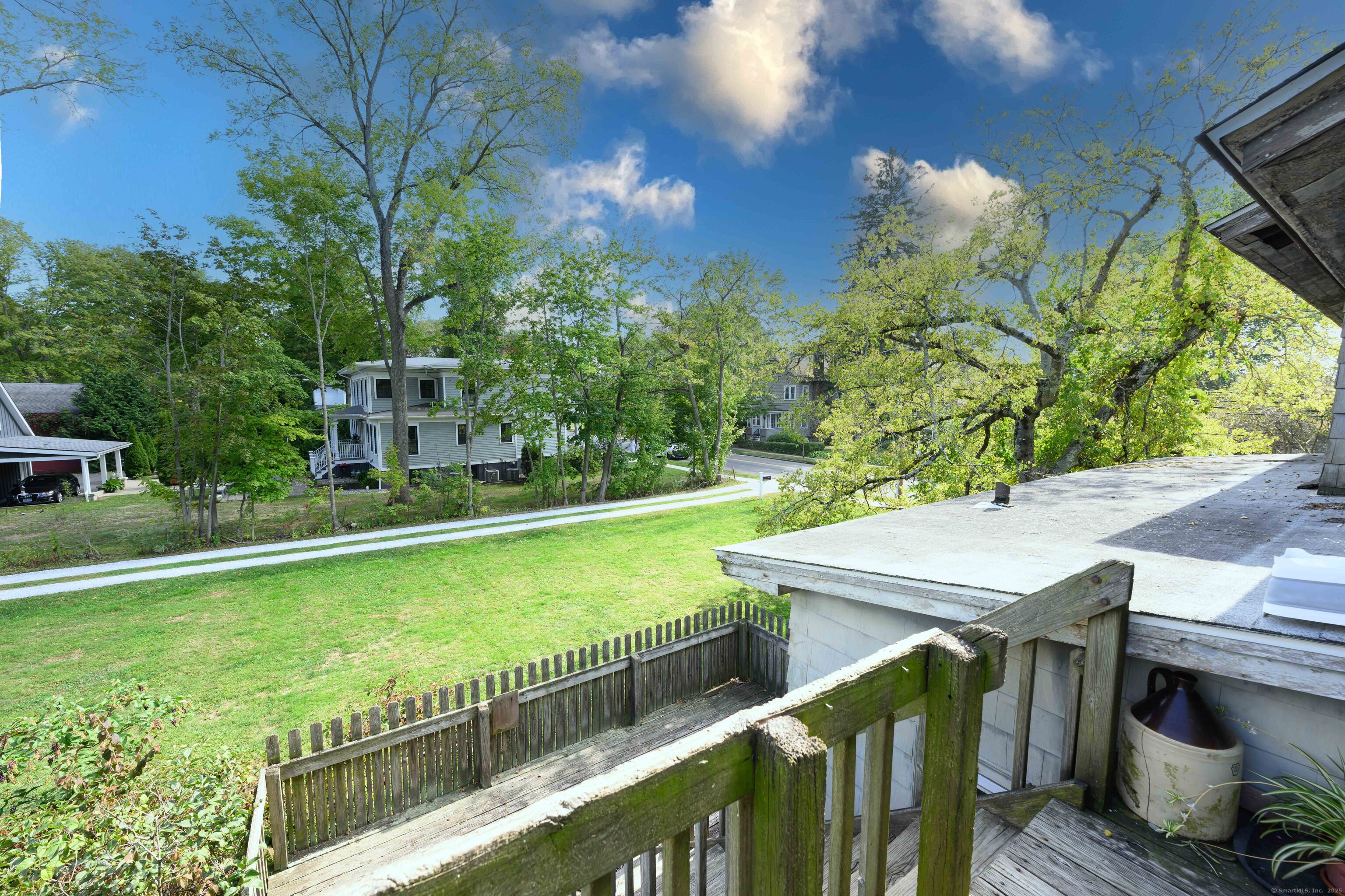 174 Whitfield Street Guilford, CT 06437 - Photo 40 of 40 a view of a balcony with two chairs and a table