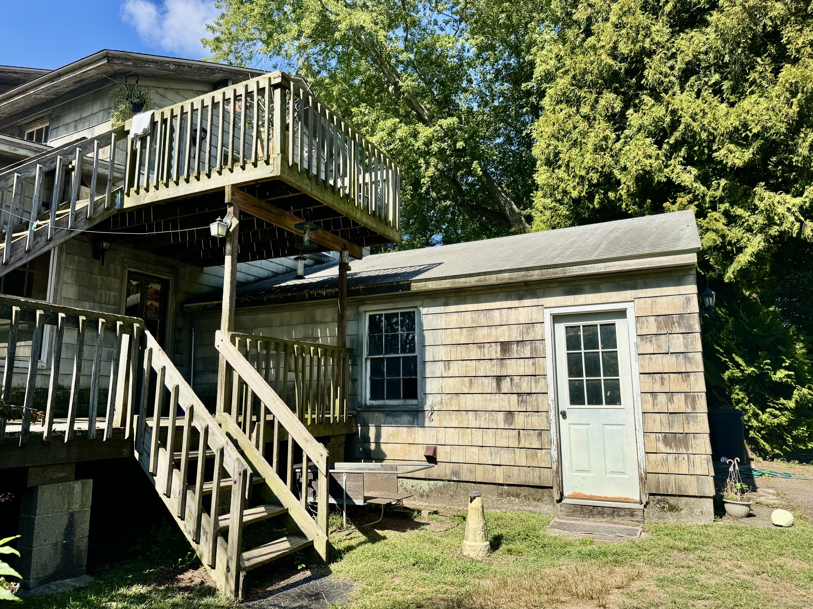 174 Whitfield Street Guilford, CT 06437 - Photo 4 of 40 a view of a house with backyard and deck