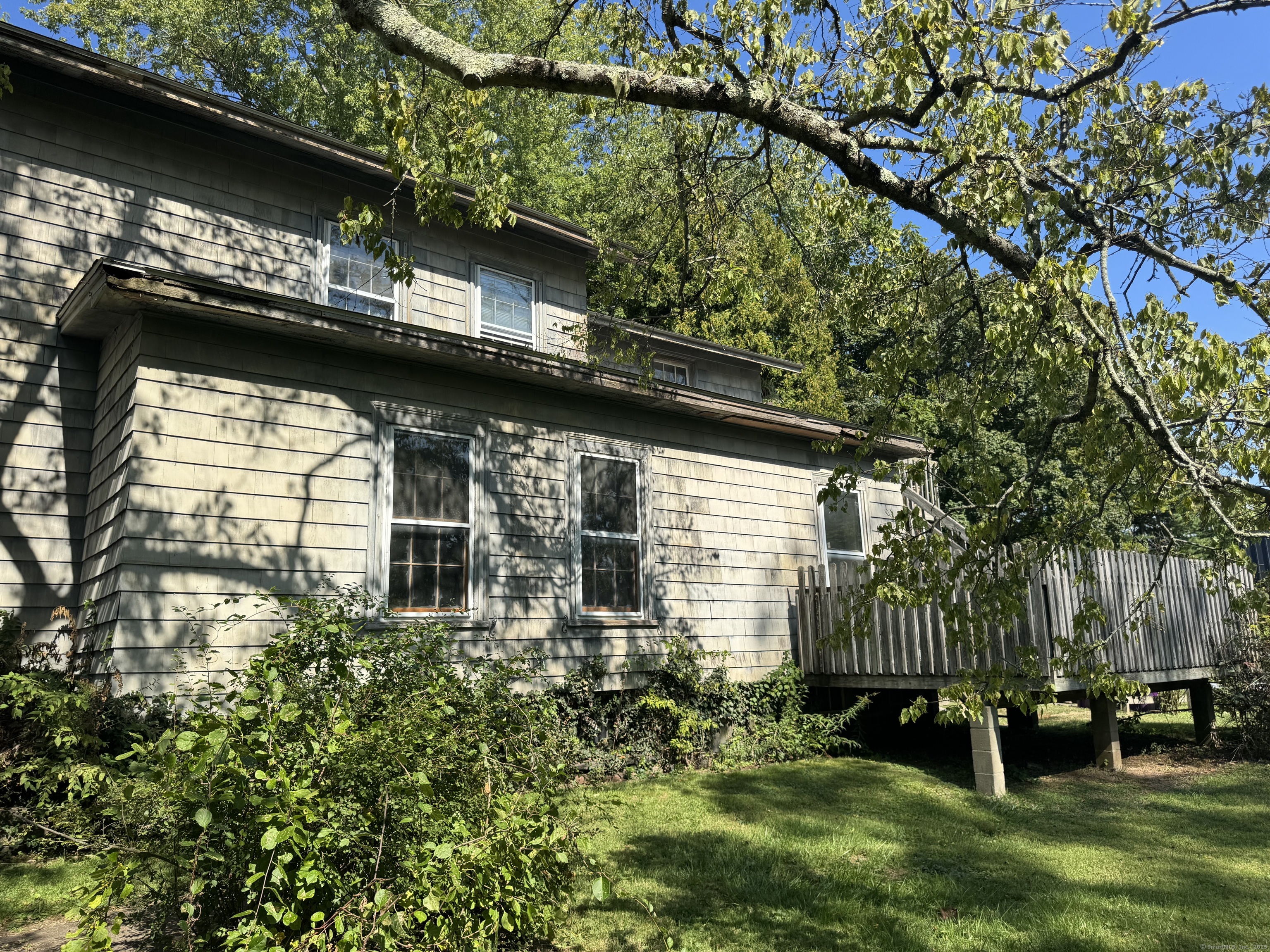 174 Whitfield Street Guilford, CT 06437 - Photo 8 of 40 a small yard with large trees