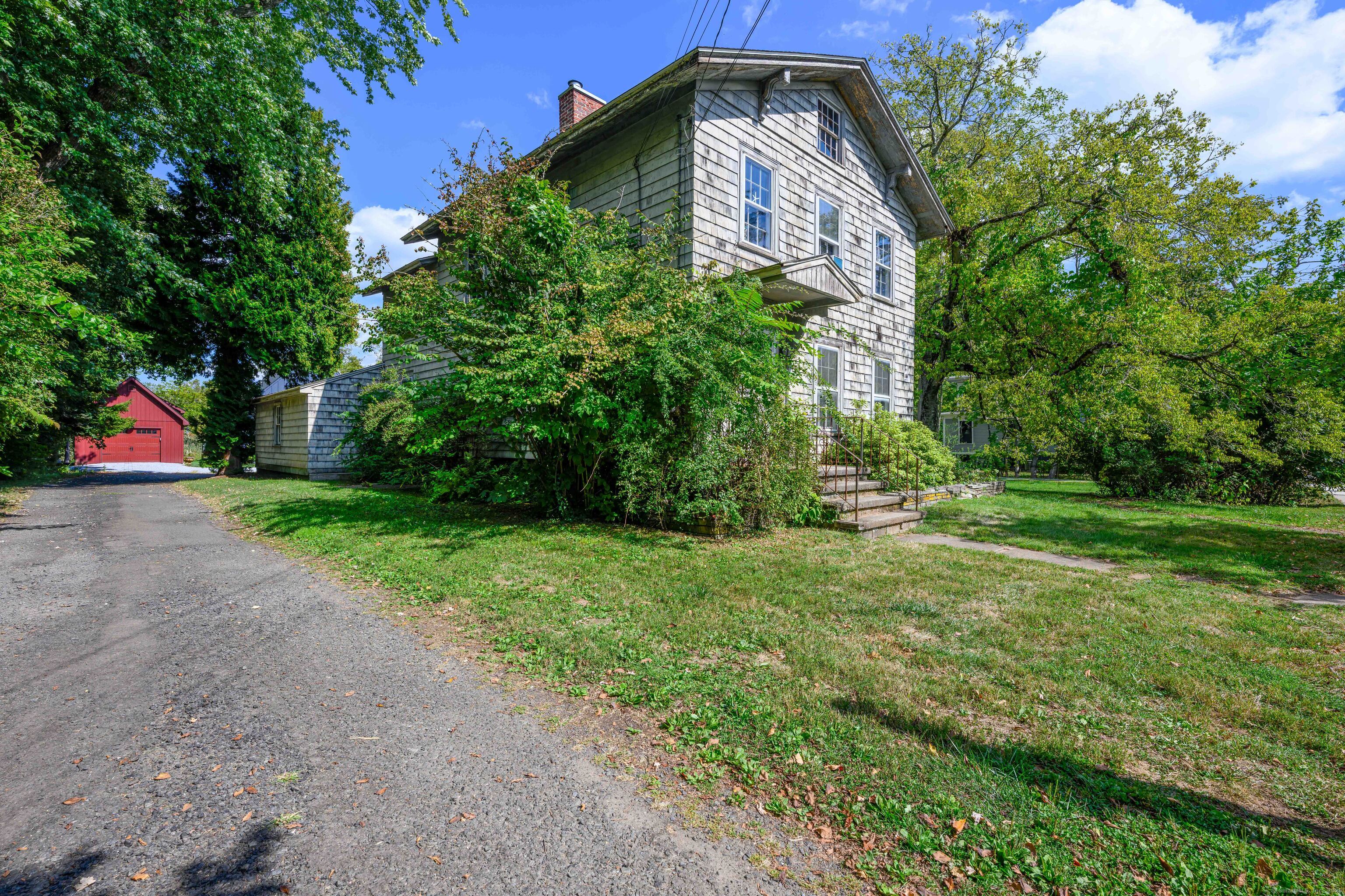 174 Whitfield Street Guilford, CT 06437 - Photo 10 of 40 a front view of house with yard and green space