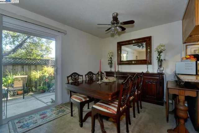 a view of a dining room with furniture window and outside view