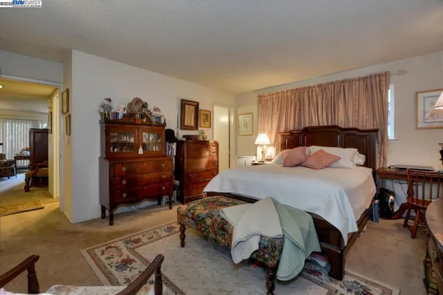 a bedroom with a bed and a cabinets