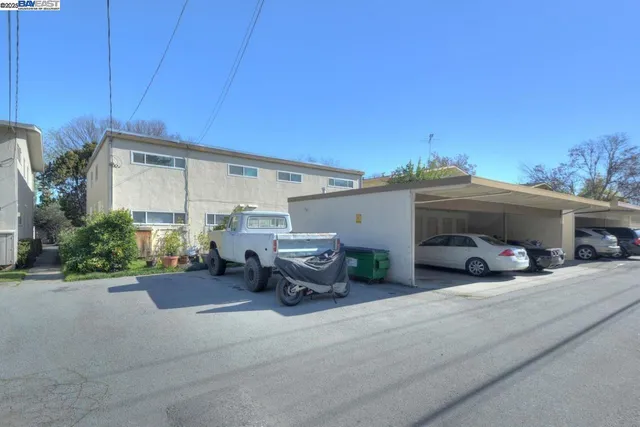 a view of a car park in front of house