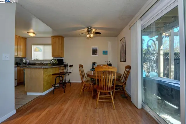 a view of a dining room with furniture and a window