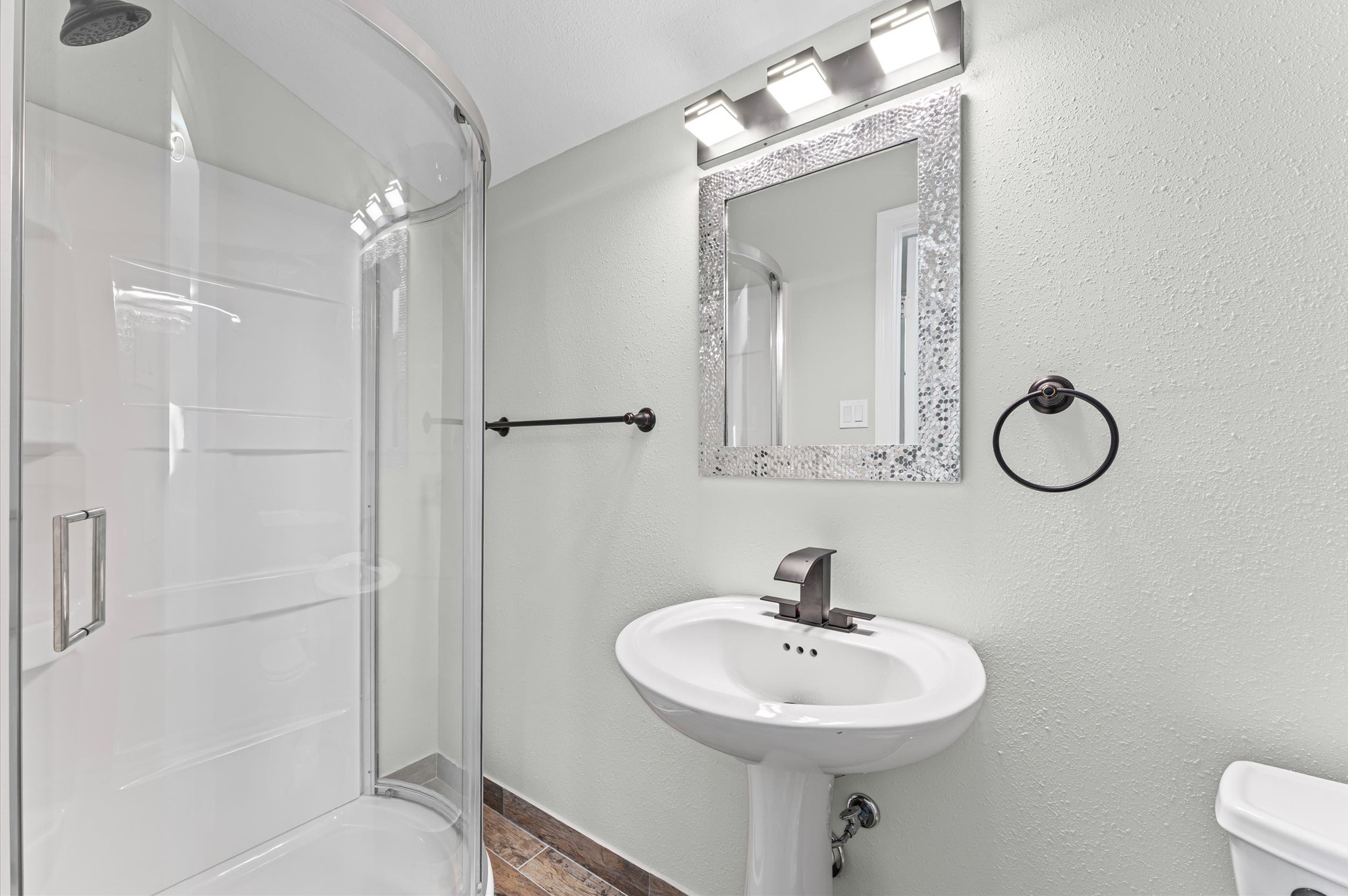 1808 North Red Cedar Circle Spring, TX 77380 - Photo 27 of 31 a bathroom with a sink a toilet a mirror and shower