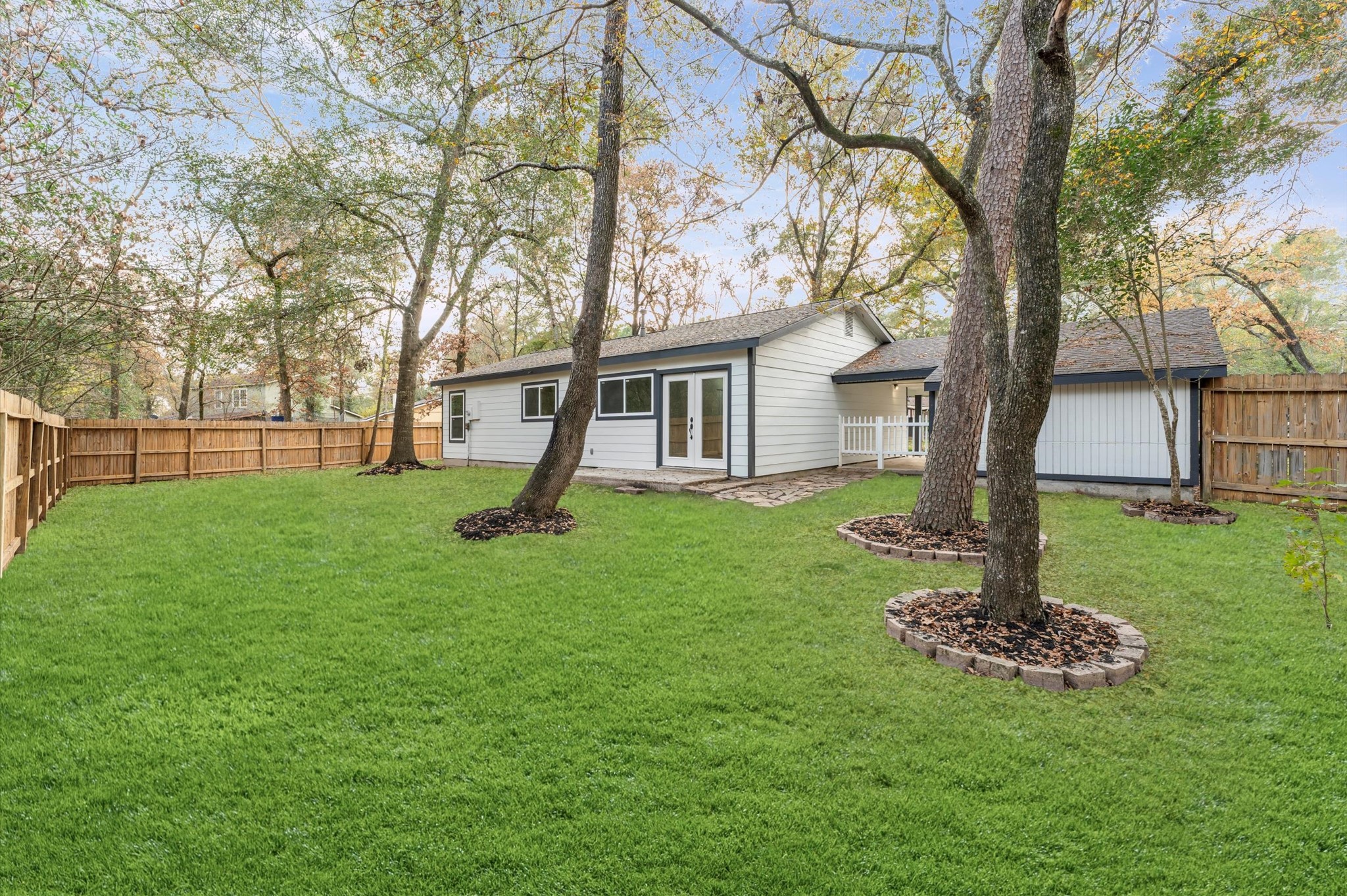 1808 North Red Cedar Circle Spring, TX 77380 - Photo 30 of 31 a house with a tree in front of a house