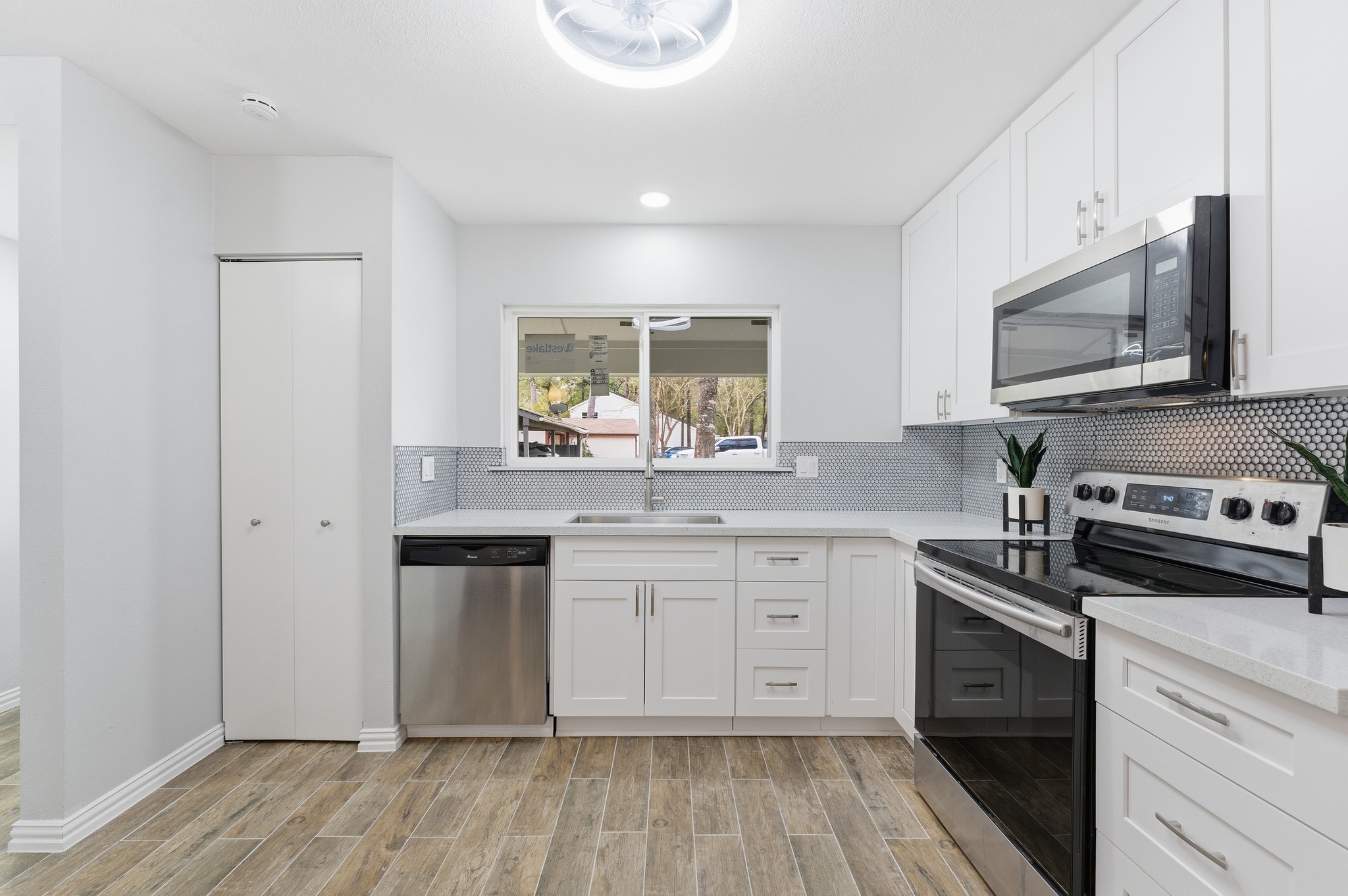 1808 North Red Cedar Circle Spring, TX 77380 - Photo 5 of 31 a kitchen with stainless steel appliances granite countertop a stove and a sink