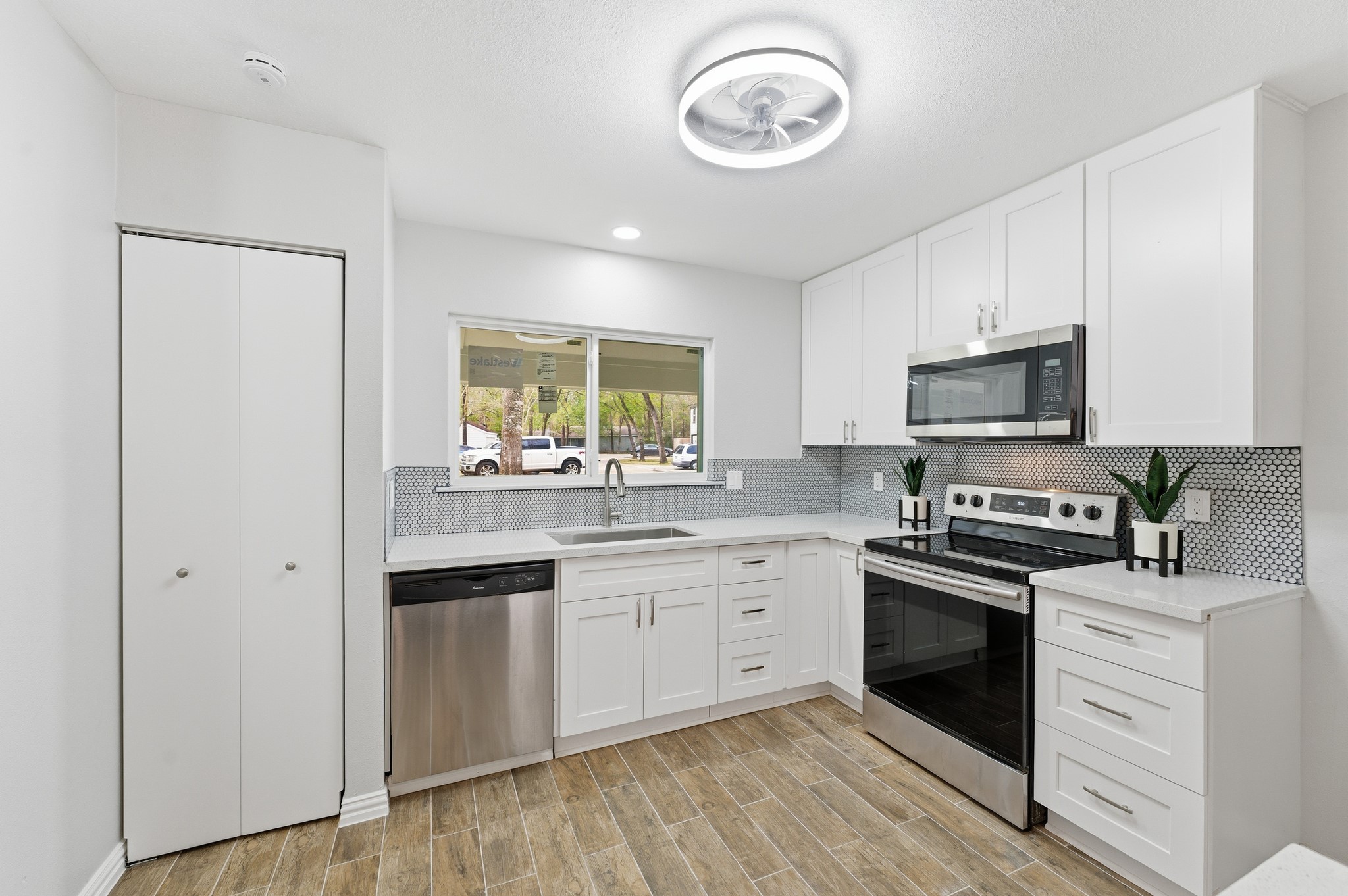 1808 North Red Cedar Circle Spring, TX 77380 - Photo 6 of 31 a kitchen with stainless steel appliances granite countertop a stove and a sink