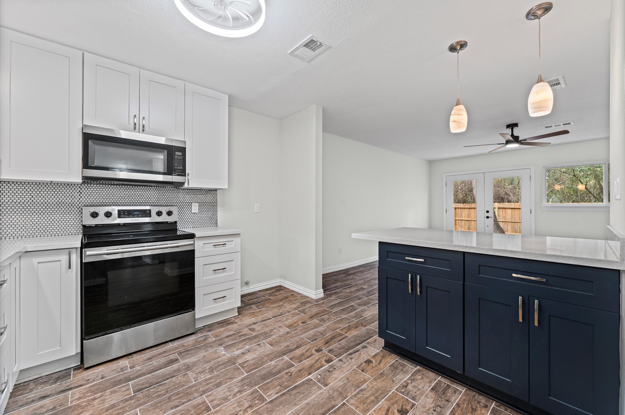 1808 North Red Cedar Circle Spring, TX 77380 - Photo 8 of 31 a kitchen with a sink and a stove top oven