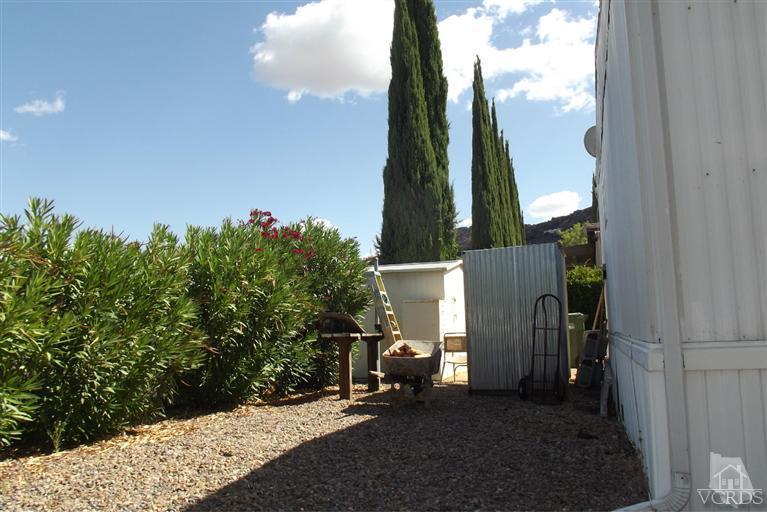 6480 Katherine Road, Unit 35 Simi Valley, CA 93063 - Photo 14 of 16 a backyard of a house with lots of green space