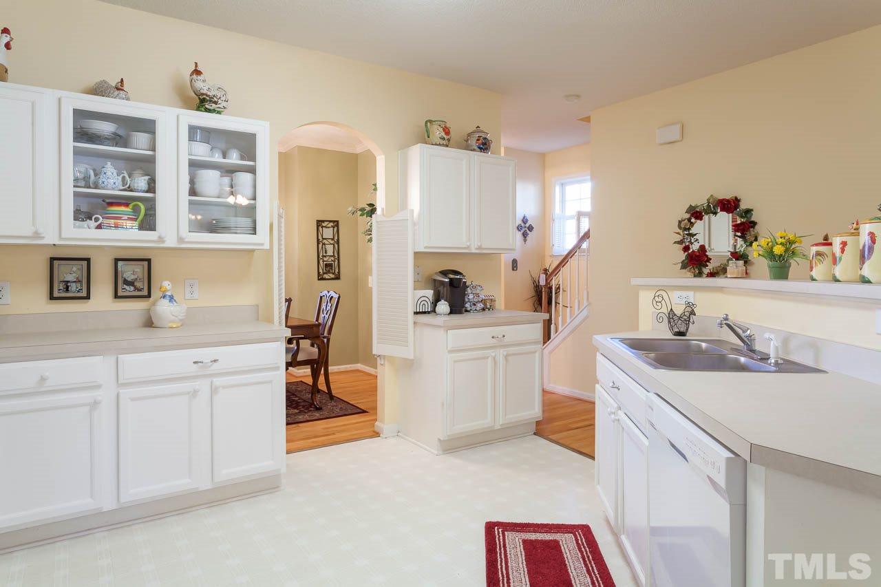 4434 Pottery Lane Raleigh, NC 27616 - Photo 14 of 25 There are cabinets galore and even some with glass doors to display your treasured items.