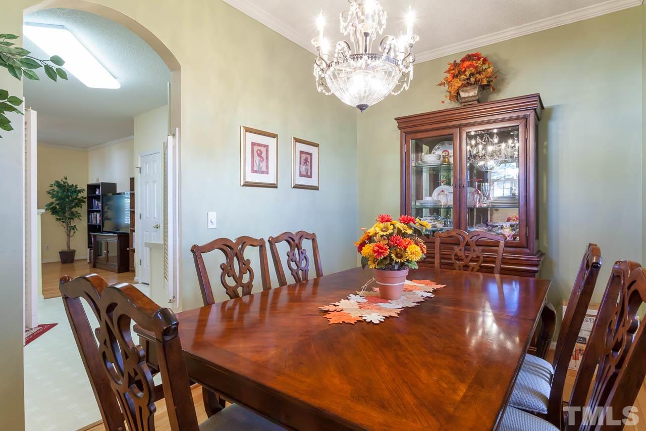 4434 Pottery Lane Raleigh, NC 27616 - Photo 8 of 25 This lovely dining room has a beautiful chandelier.