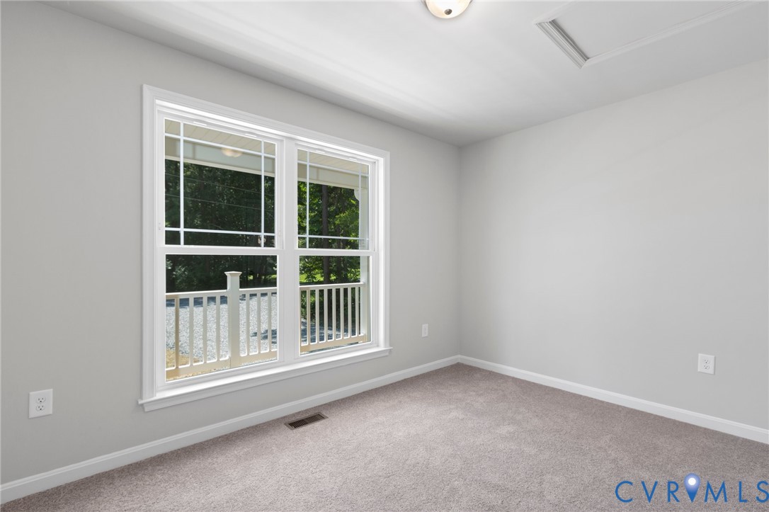 69 Pinewood Lane Colonial Beach, VA 22443 - Photo 11 of 20 Carpeted spare room with baseboards