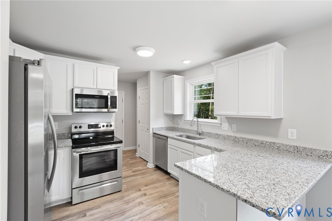 69 Pinewood Lane Colonial Beach, VA 22443 - Photo 5 of 20 Kitchen featuring stainless steel appliances, ligh