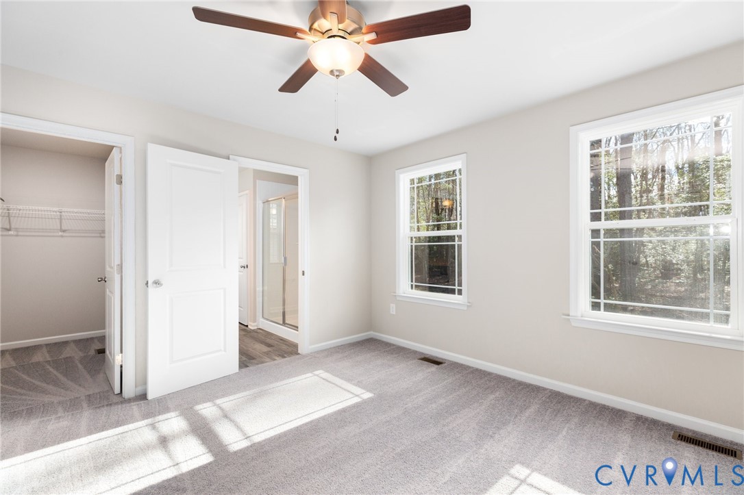 69 Pinewood Lane Colonial Beach, VA 22443 - Photo 7 of 20 Unfurnished bedroom with light colored carpet, a c