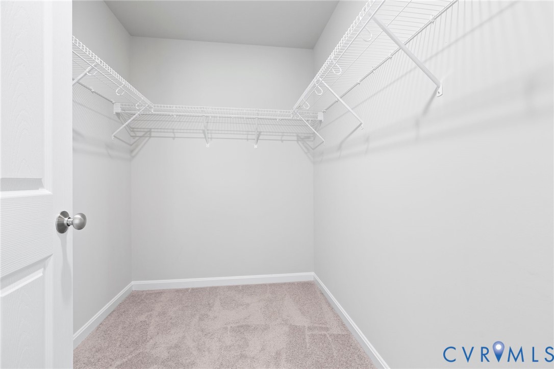 69 Pinewood Lane Colonial Beach, VA 22443 - Photo 8 of 20 Spacious closet featuring light carpet