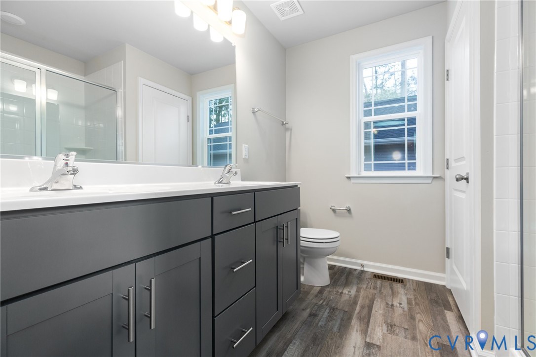 69 Pinewood Lane Colonial Beach, VA 22443 - Photo 9 of 20 Full bath with a shower stall, double vanity, dark