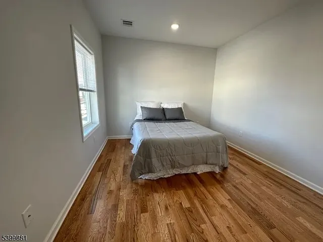 a view of a kitchen from the hallway
