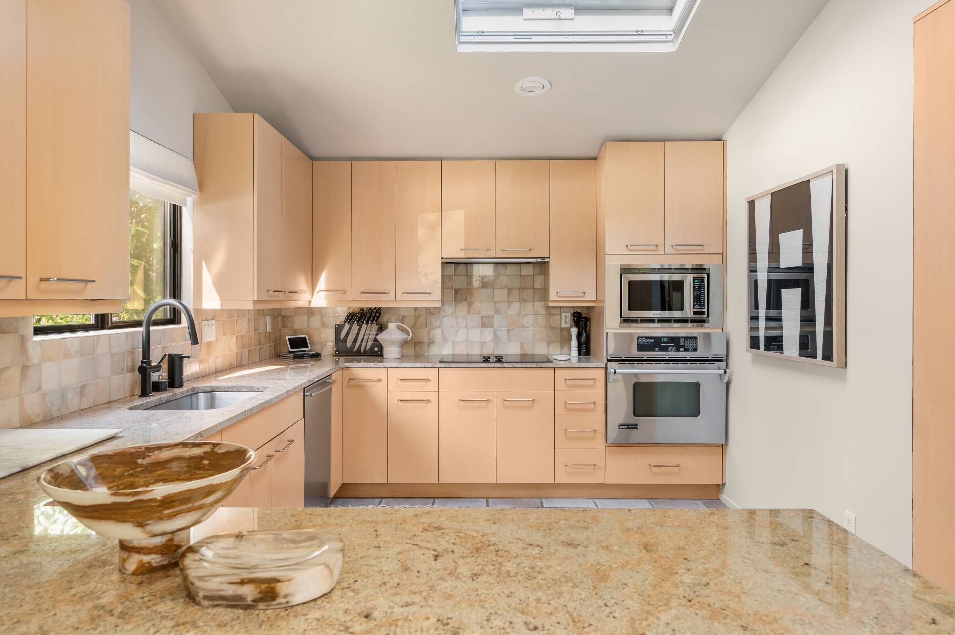 12 Rivers Road East Hampton, NY 11937 - Photo 13 of 23 a kitchen with stainless steel appliances granite countertop a stove a sink and white cabinets