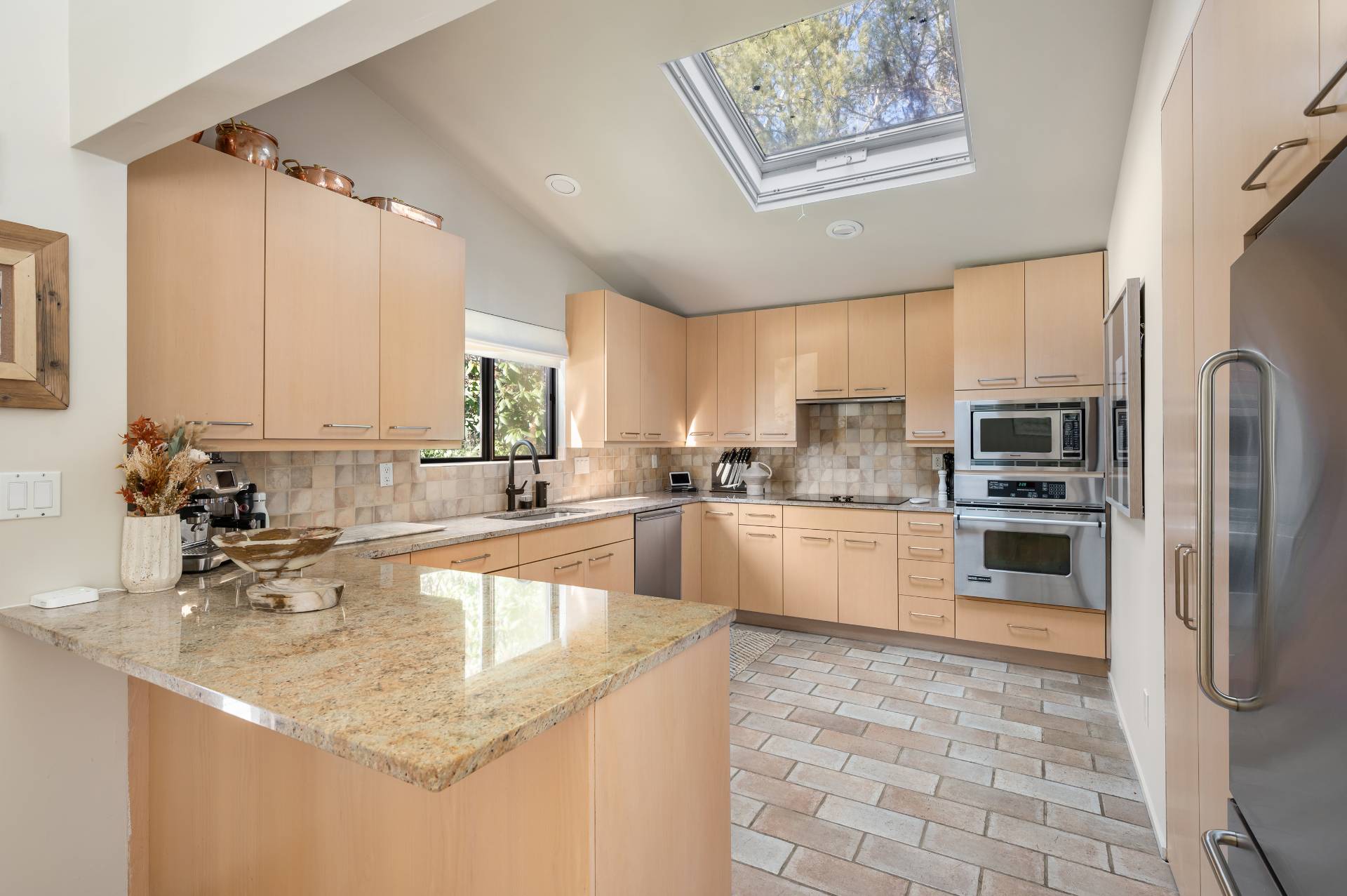 12 Rivers Road East Hampton, NY 11937 - Photo 14 of 23 a kitchen with stainless steel appliances granite countertop a sink a stove and a refrigerator