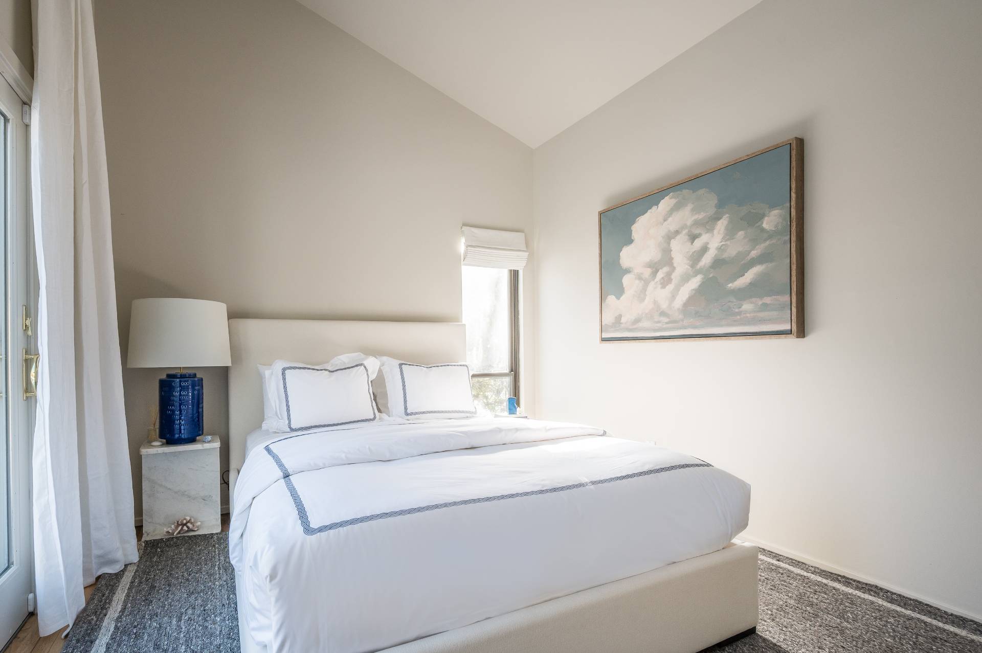 12 Rivers Road East Hampton, NY 11937 - Photo 21 of 23 a bedroom with a bed and a painting on the wall