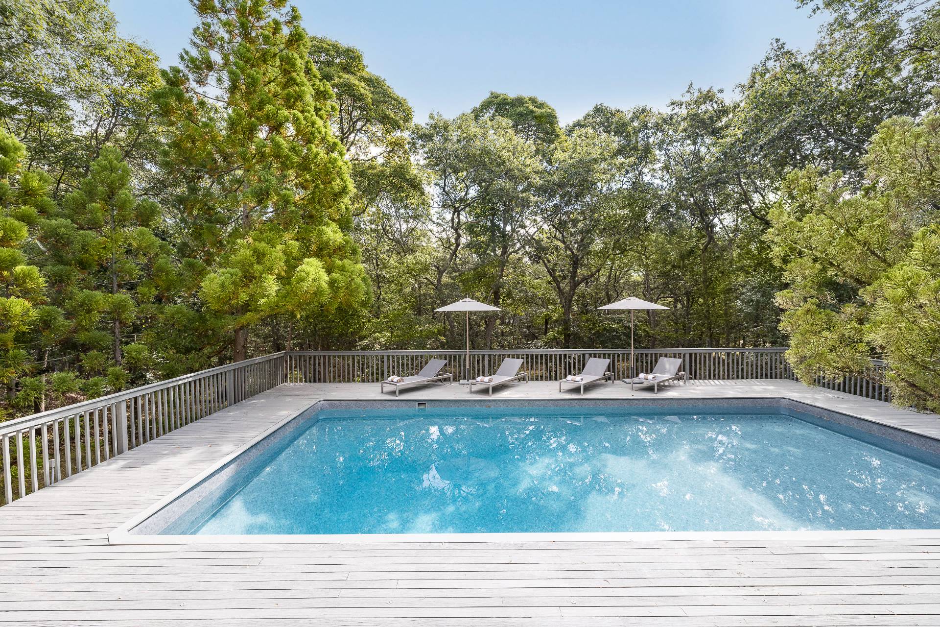 12 Rivers Road East Hampton, NY 11937 - Photo 3 of 23 a view of a swimming pool with a yard