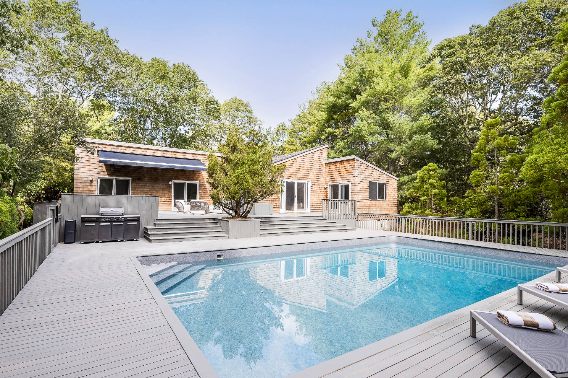 12 Rivers Road East Hampton, NY 11937 - Photo 7 of 23 a view of house with swimming pool and sitting area