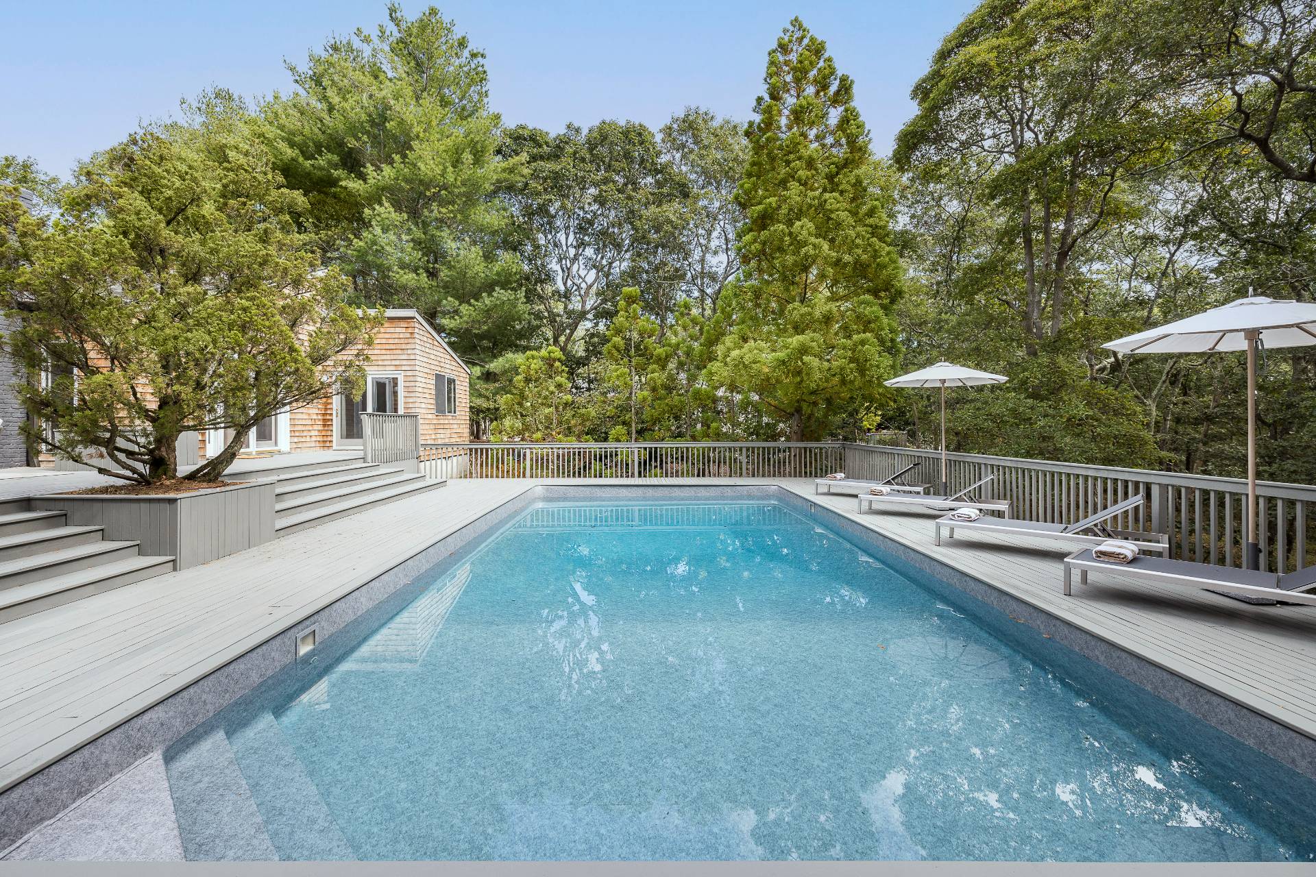 12 Rivers Road East Hampton, NY 11937 - Photo 8 of 23 a view of a backyard with swimming pool