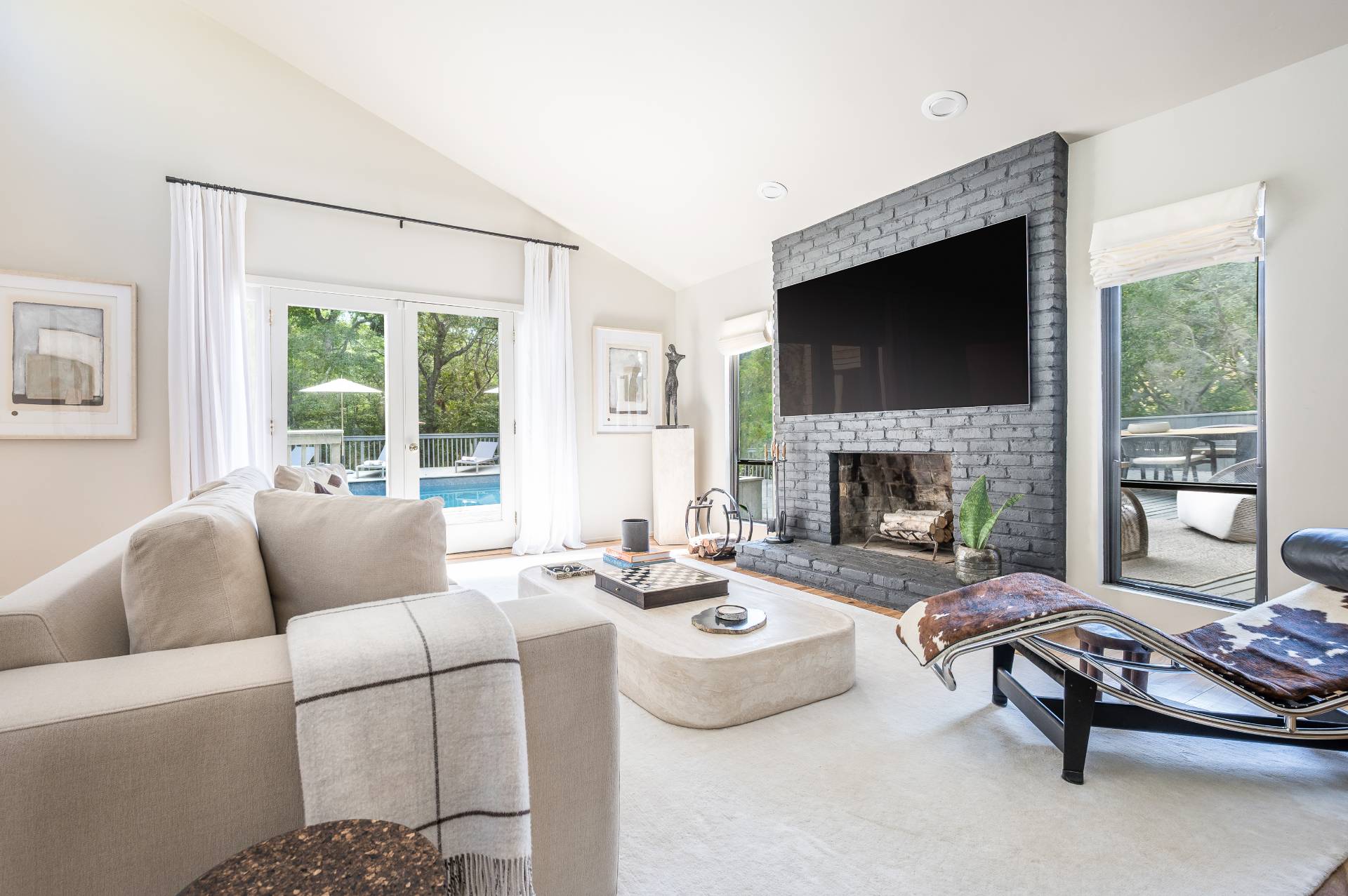 12 Rivers Road East Hampton, NY 11937 - Photo 10 of 23 a living room with furniture fireplace and a flat screen tv