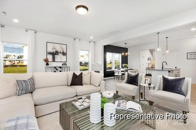 a living room with furniture and a table
