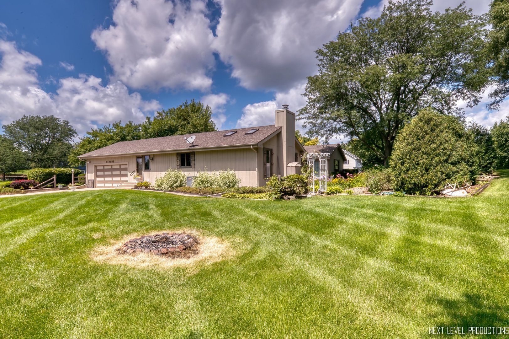 11N699 Old Barn Road Elgin, IL 60124 - Photo 29 of 32 a front view of house with yard and trees