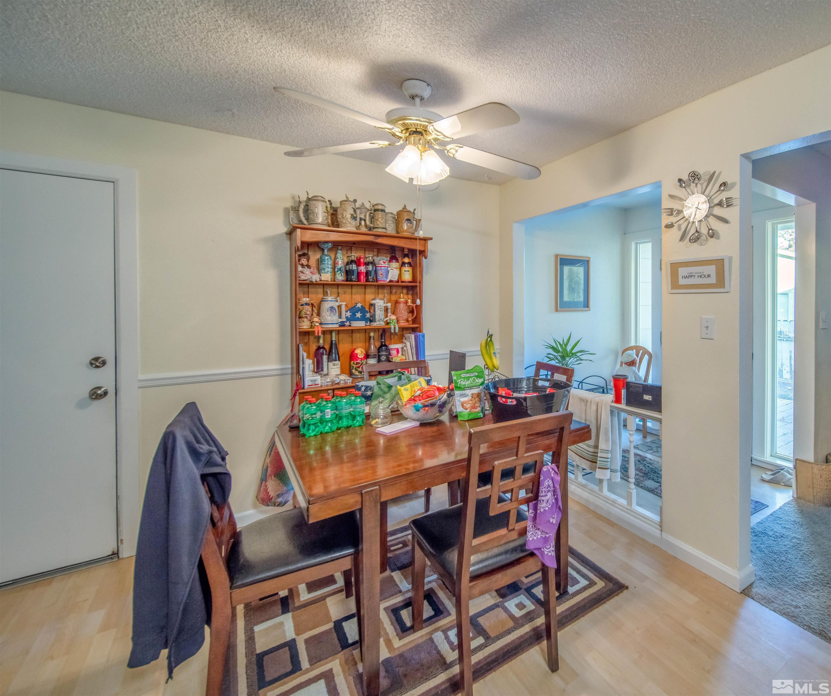 6480 Lotus Street Reno, NV 89506 - Photo 10 of 22 a view of a dining room with furniture and wooden floor