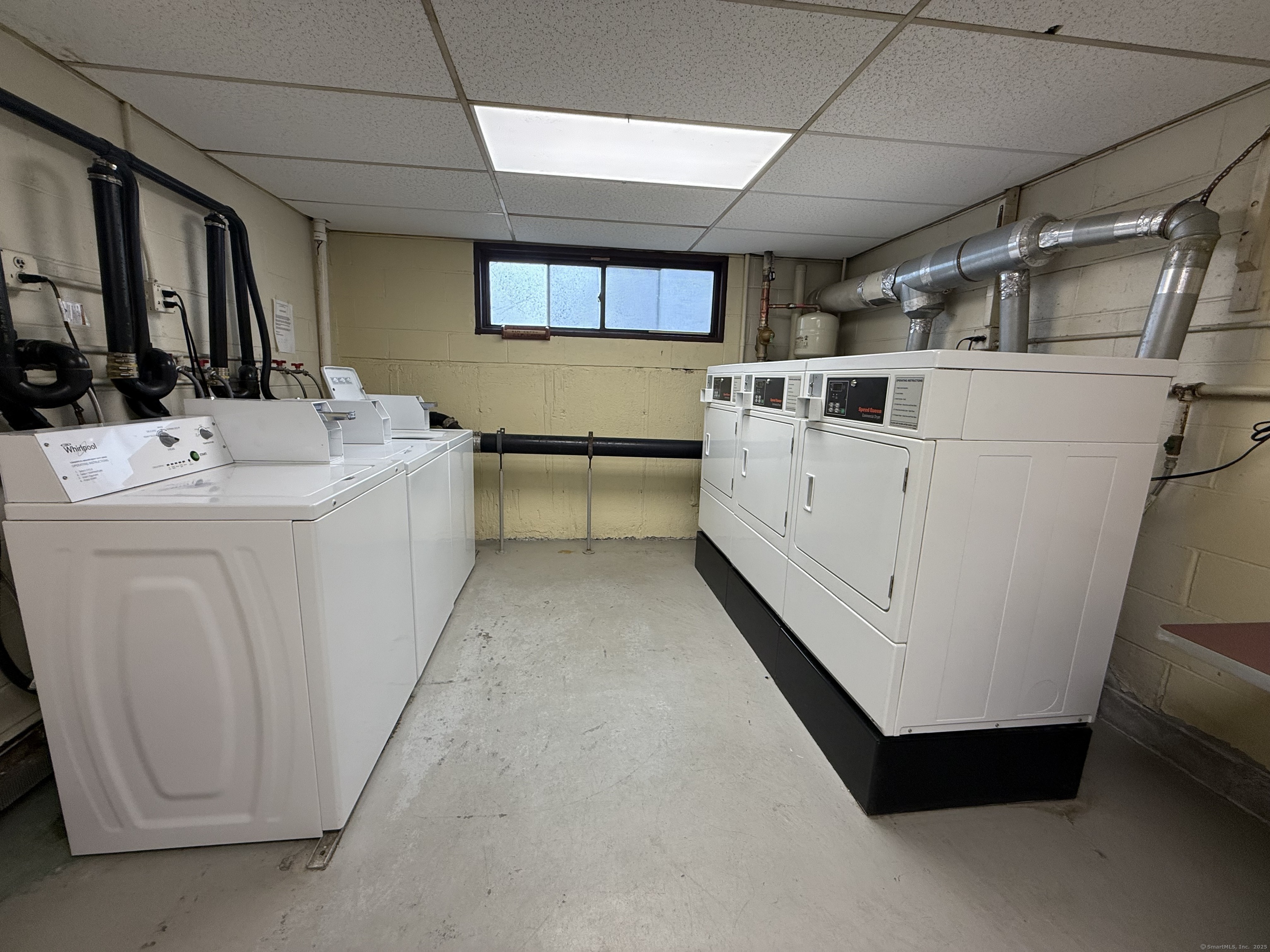 1168 Main Street, Unit C7 Stratford, CT 06615 - Photo 12 of 12 a utility room with dryer and washer