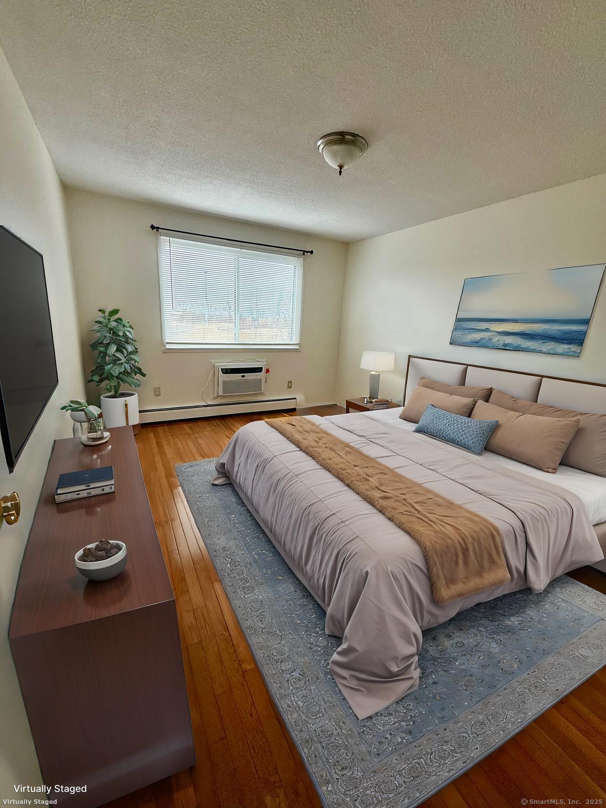 1168 Main Street, Unit C7 Stratford, CT 06615 - Photo 2 of 12 a bedroom with bed and window