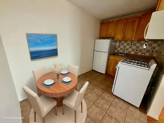 a view of a kitchen with appliances and cabinets