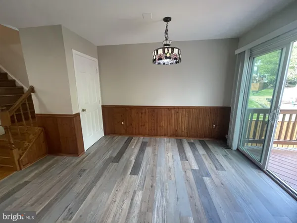 a view of wooden floor and brick walls
