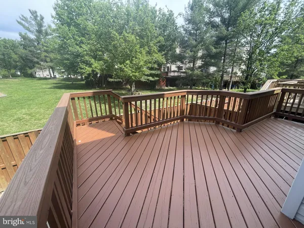 a view of balcony with wooden floor