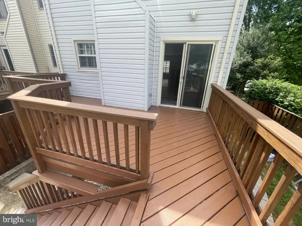 a balcony with wooden floor