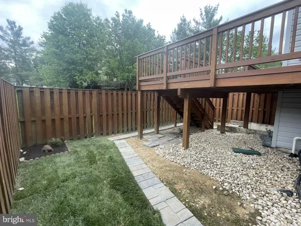 a view of a two chairs in the back yard
