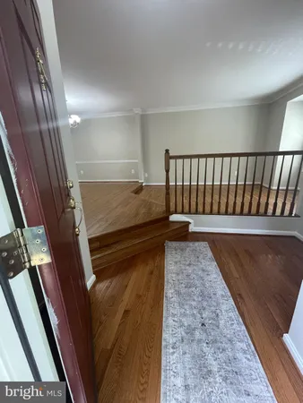 a view of bedroom and wooden floor