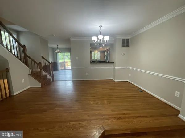 a view of a livingroom with wooden floor
