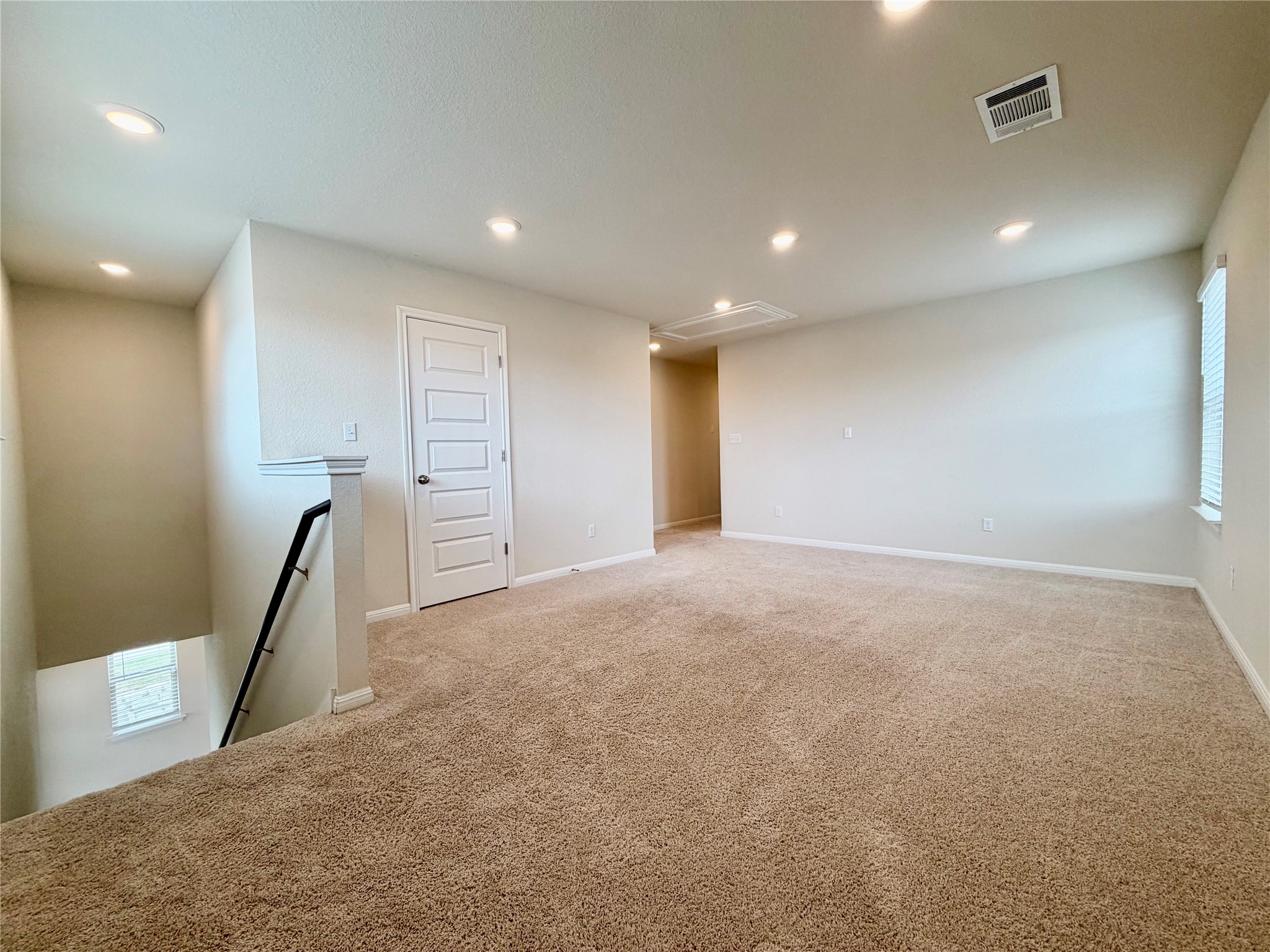305 Tolo Drive Elgin, TX 78621 - Photo 17 of 27 Spacious upper-level loft featuring plush carpet flooring, recessed lighting, and a neutral color palette